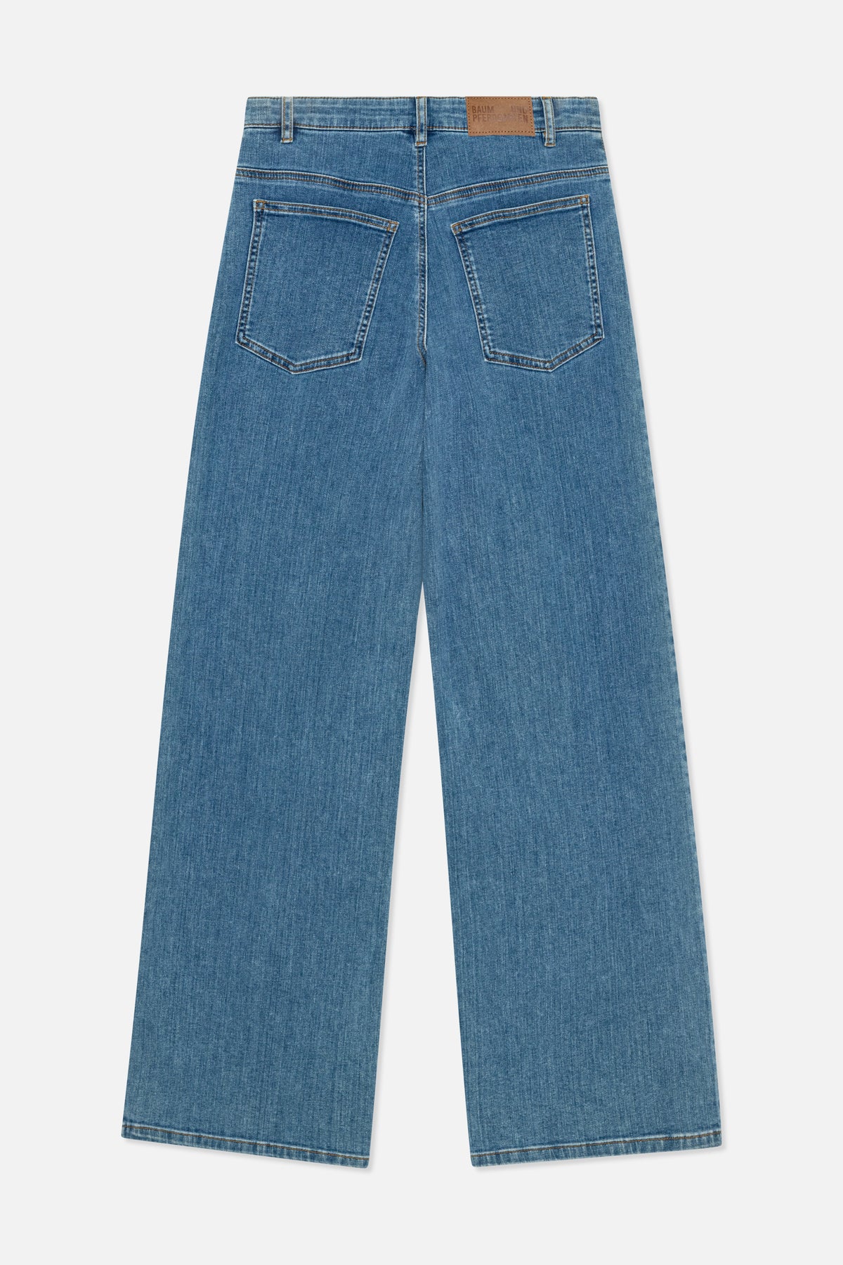 Rear view of wide-leg blue jeans with two back pockets, contrast stitching and a brown leather waistband patch.