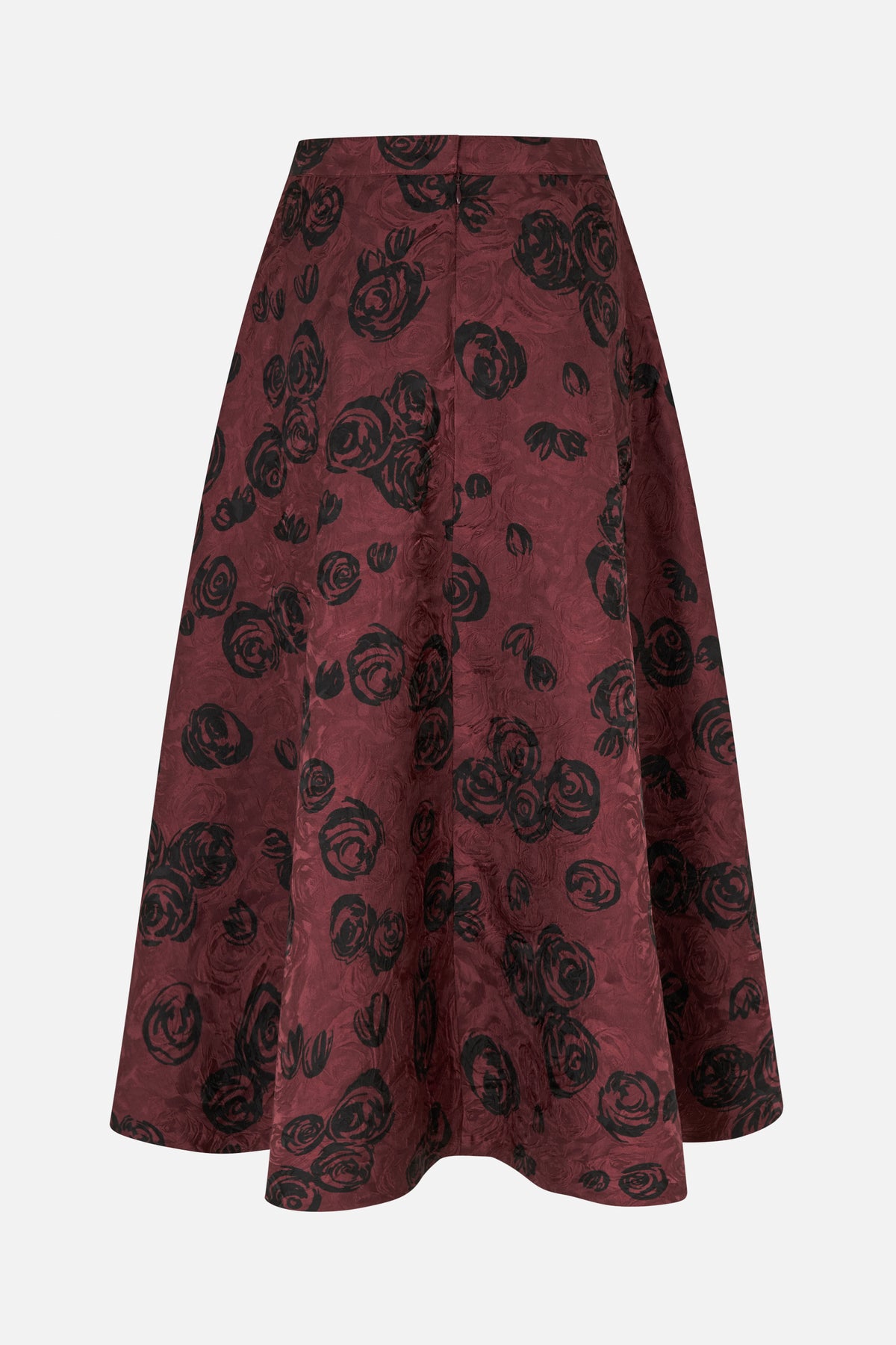 Back view of a burgundy A-line skirt with a black rose print, waistband and centre-back zipper.