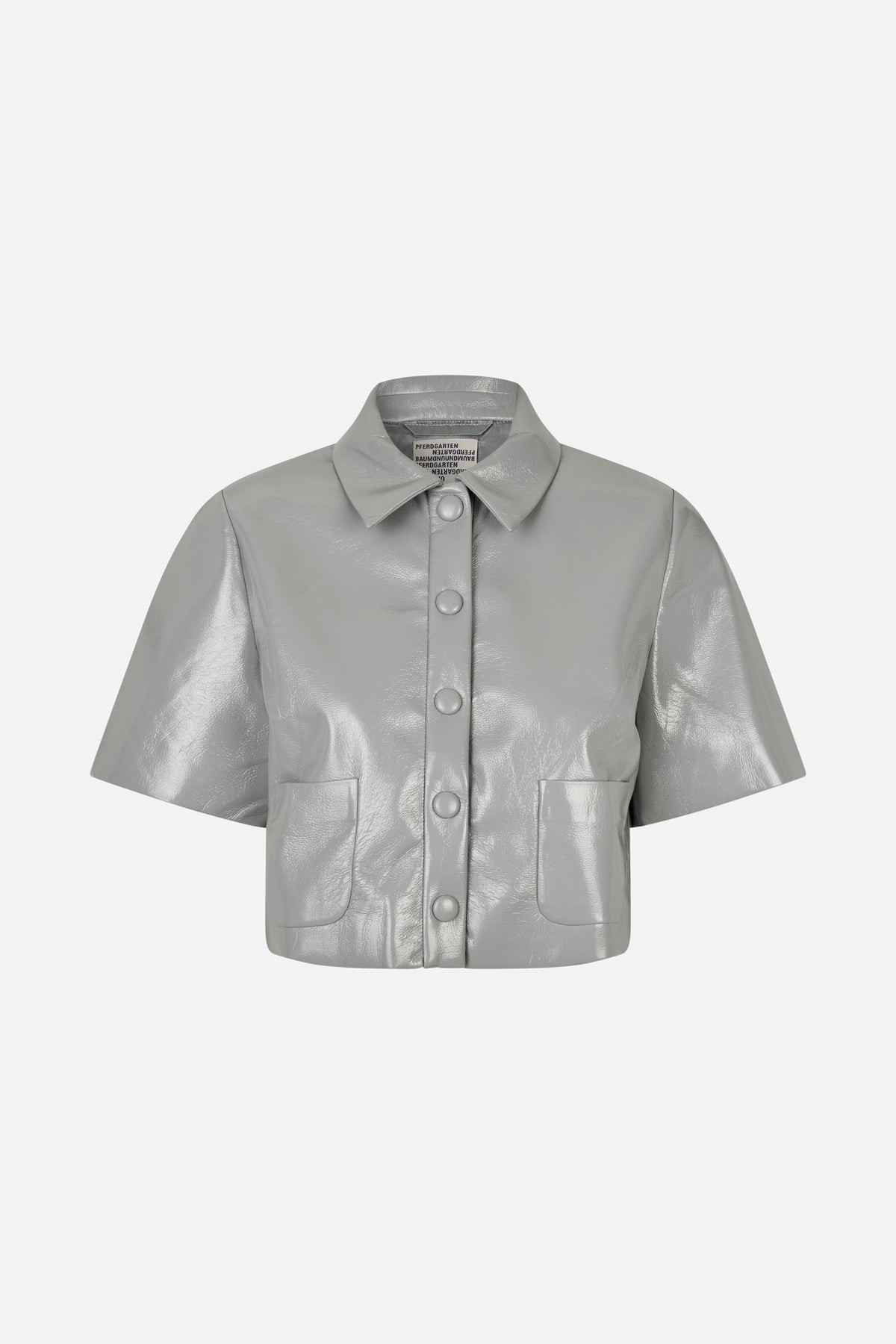 Front view of a light grey glossy short-sleeved shirt with a pointed collar, covered buttons and two patch pockets.