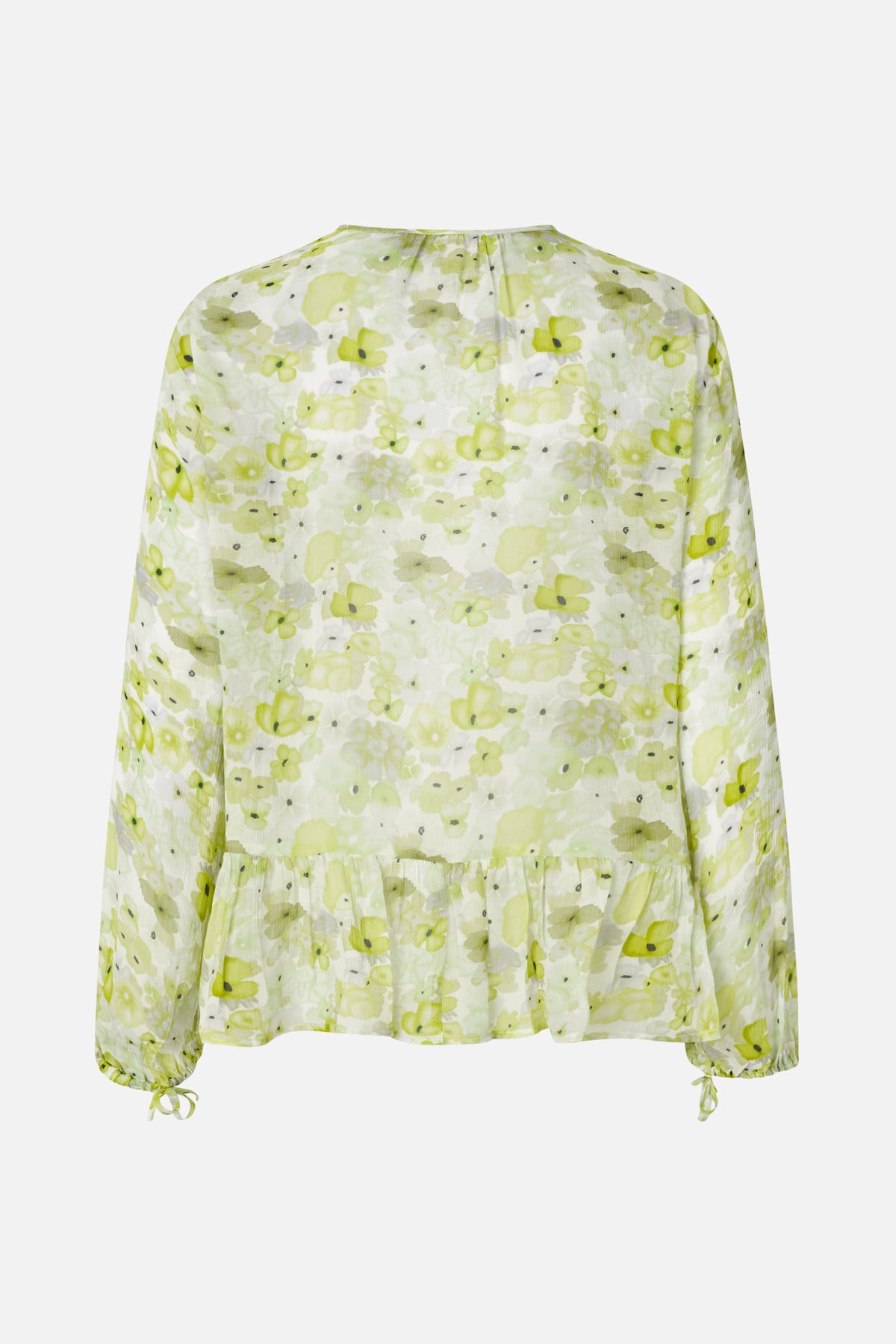 Back view of a white long-sleeved blouse with a lime-green floral print, gathered peplum hem and tie cuffs