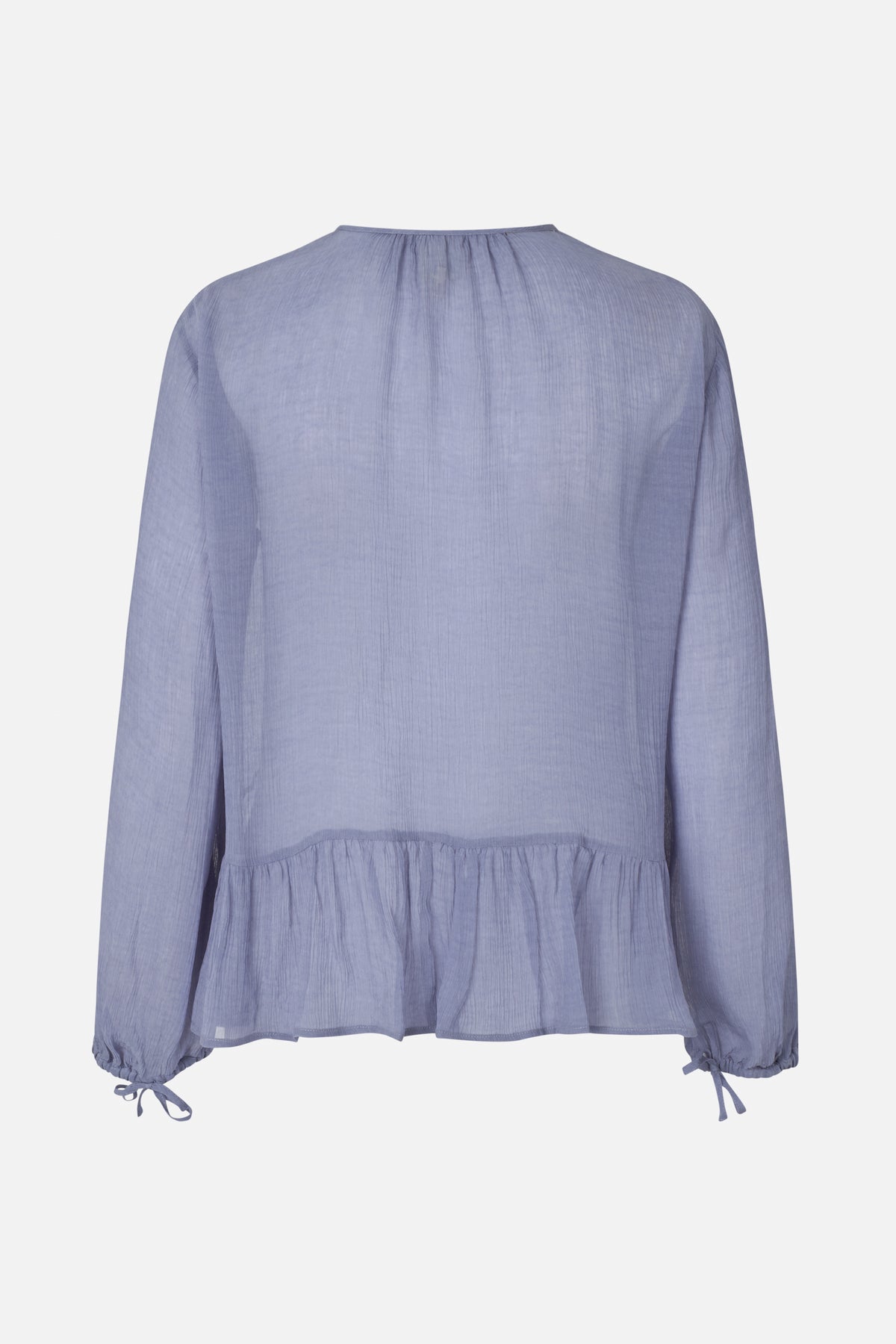 Light blue long-sleeved blouse shown from the back, with a gathered neckline, ruffled peplum hem and tie cuffs.
