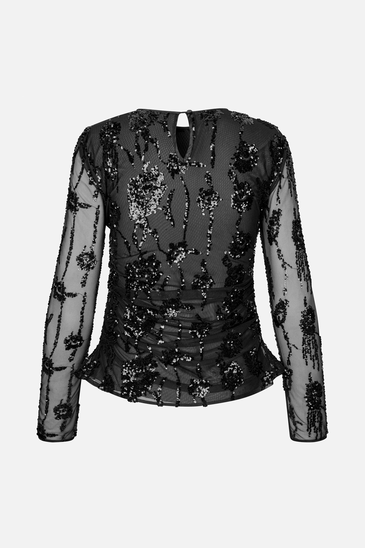 Back view of a black sheer long-sleeved mesh top with floral sequin embellishment, a keyhole neckline and a ruched waist.