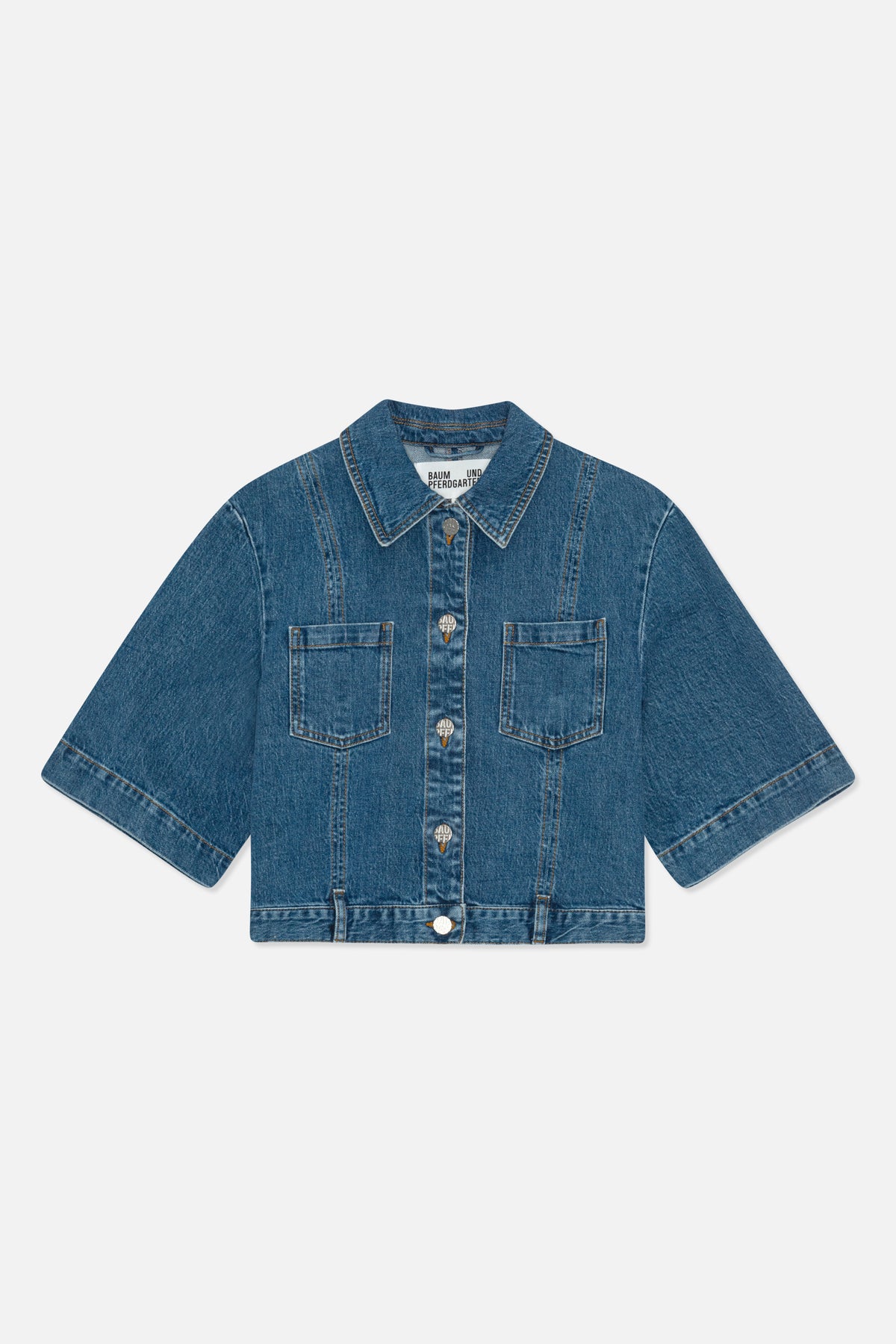 Front view of a blue denim jacket with short wide sleeves, pointed collar, button front, contrast stitching and two chest pockets.