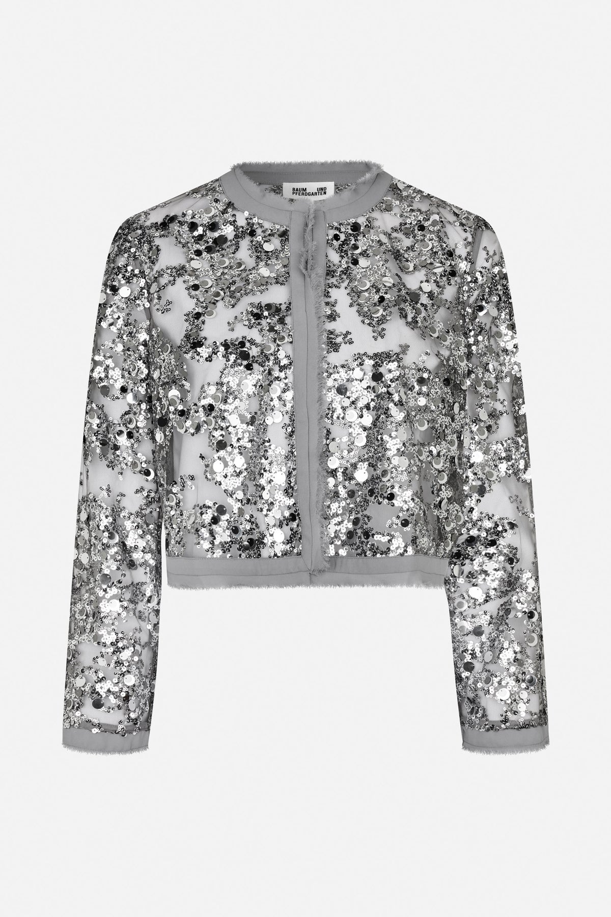 Front view of a cropped long-sleeved jacket covered in silver, black and white sequins, with grey trim and a round neckline.