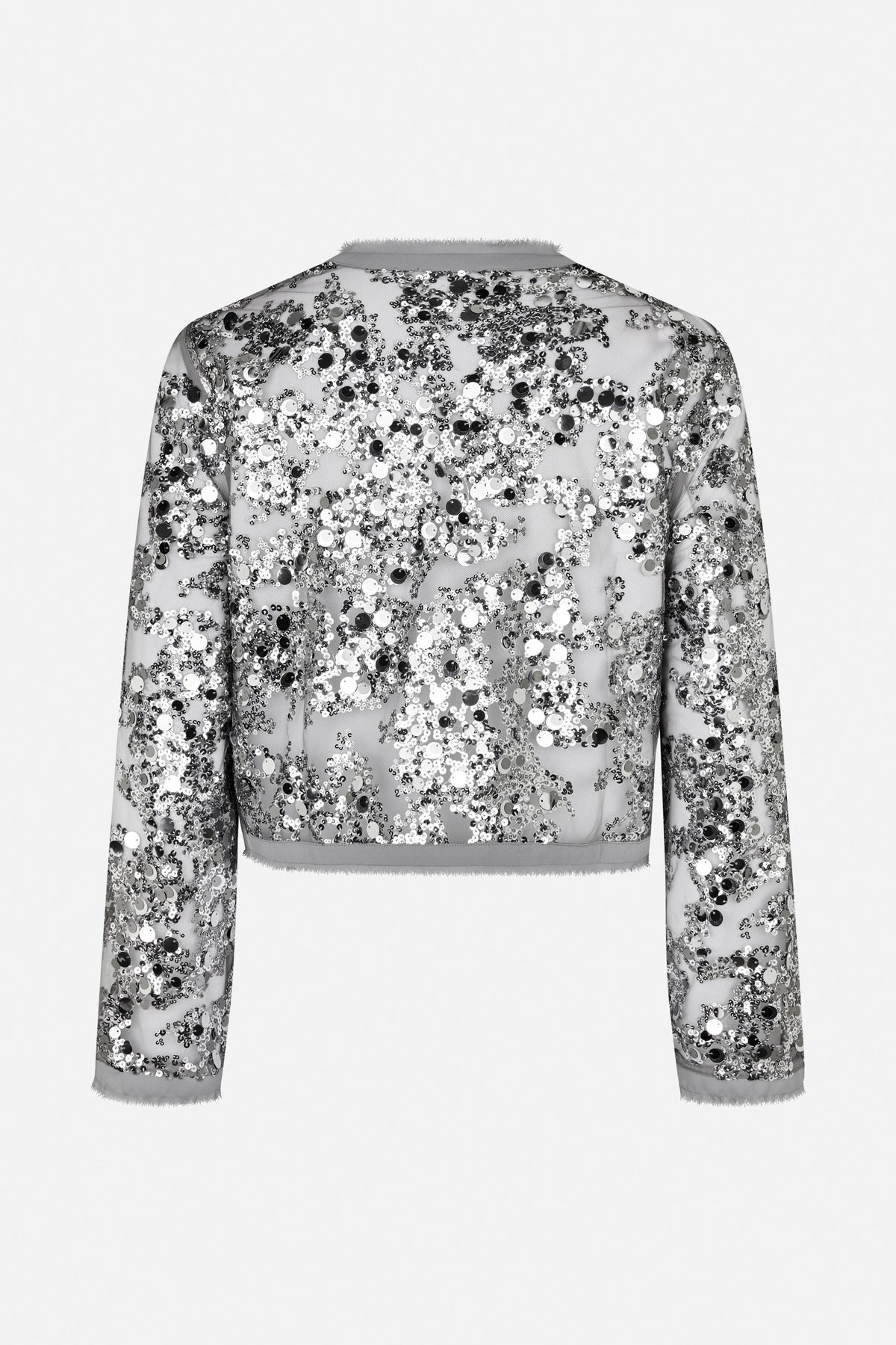 Back view of a cropped sheer mesh jacket covered in black, silver and white sequins, with long sleeves and soft-edged trim.