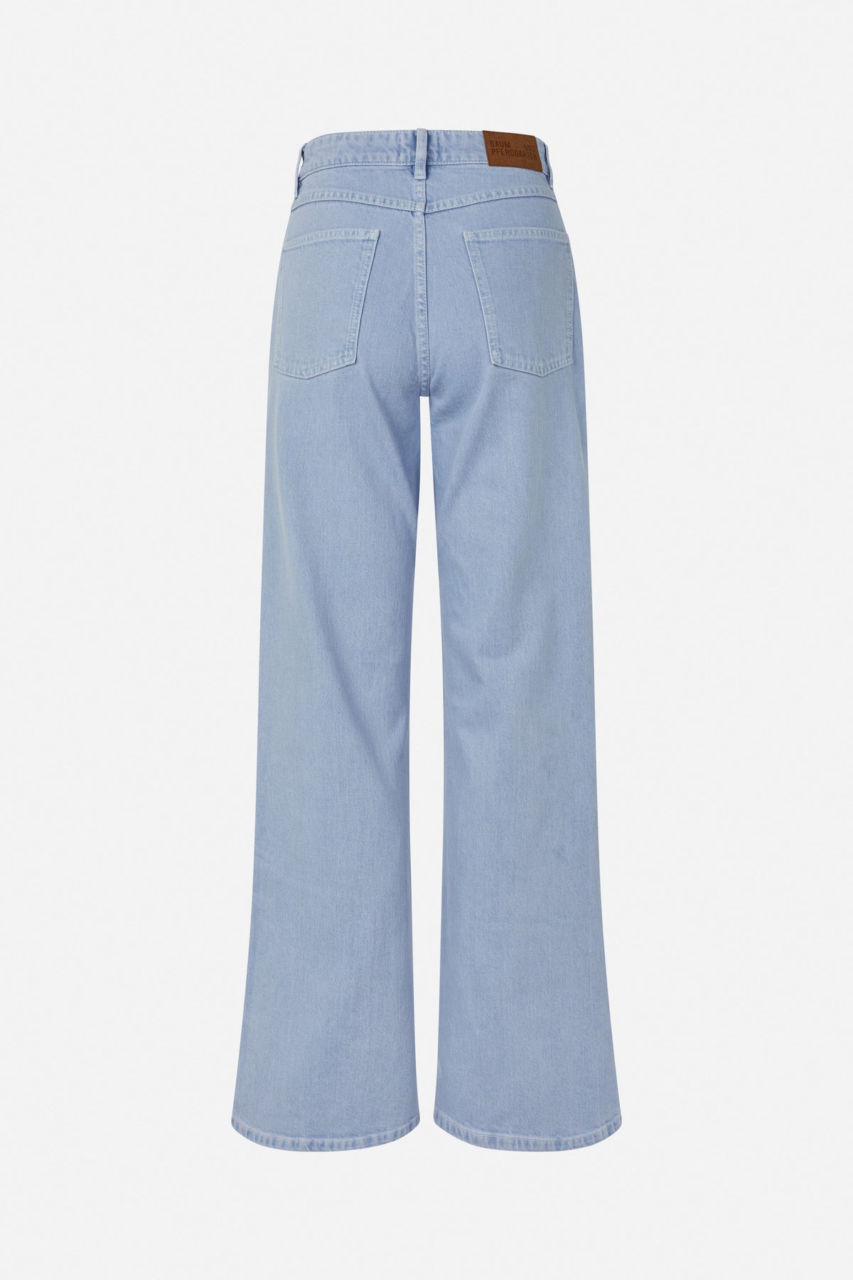 Back view of pale blue wide-leg jeans with two patch pockets and a brown leather waistband patch.