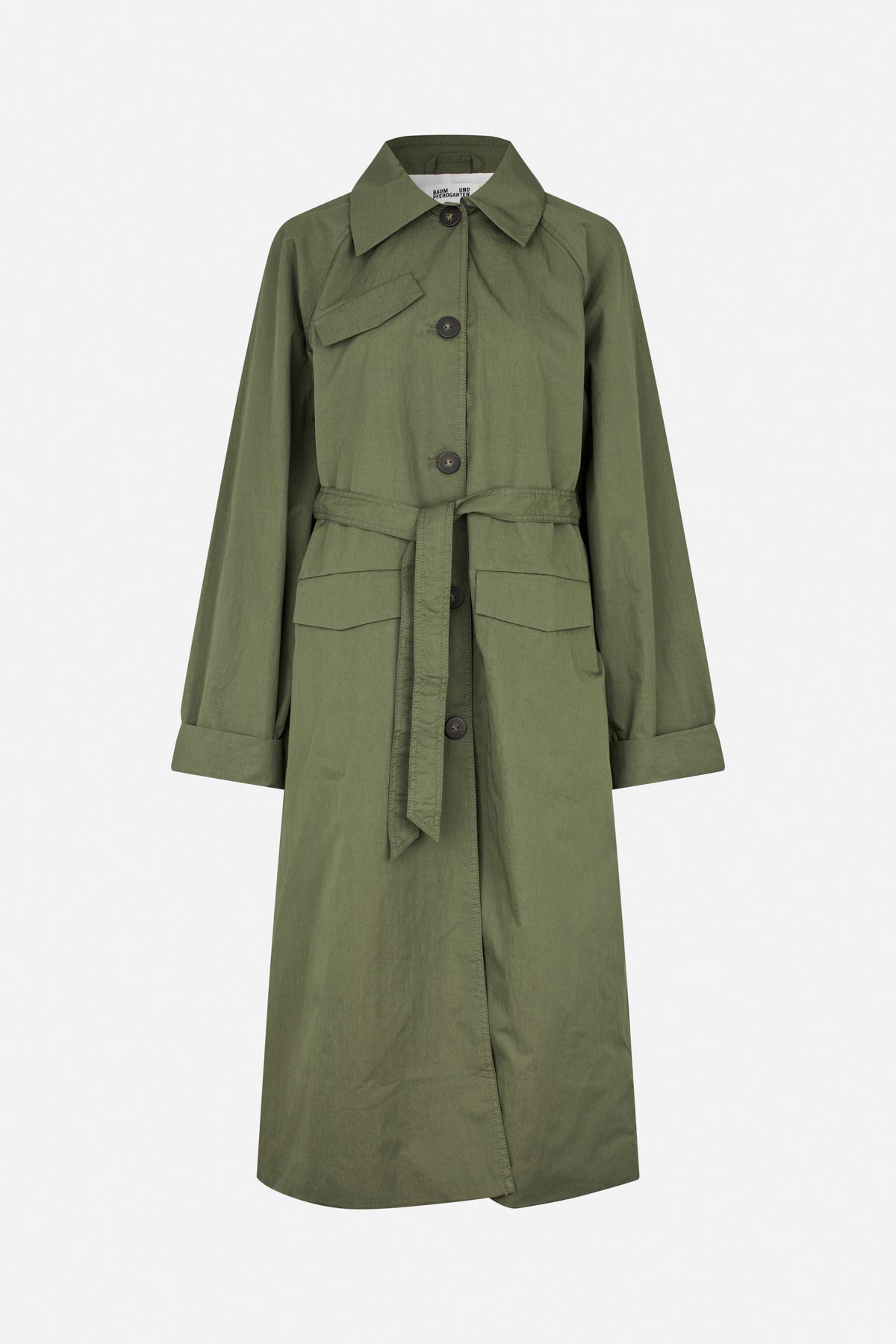 Front view of an olive green trench coat with a pointed collar, button fastening, belted waist and flap pockets.