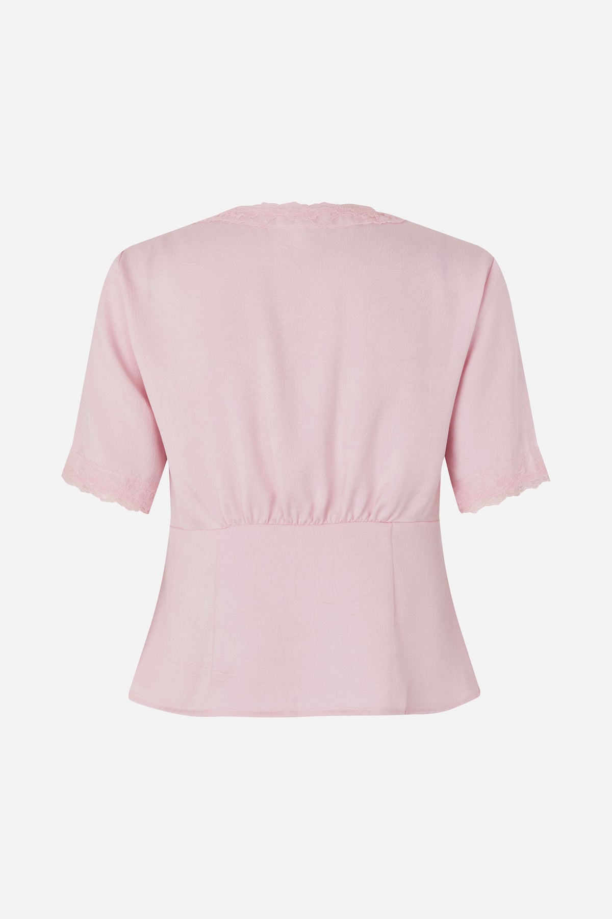 Back view of a pale pink short-sleeved blouse with lace-trimmed neckline and cuffs, a gathered waist and flared hem