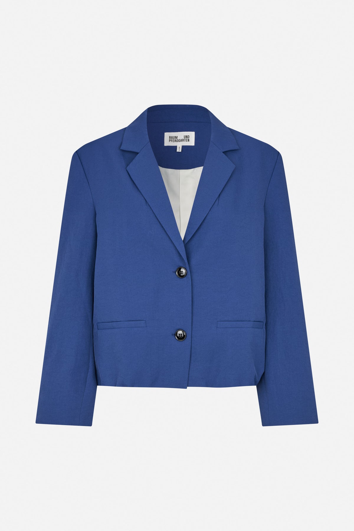 Front view of a cropped cobalt blue blazer with notched lapels, two dark buttons and welt pockets.