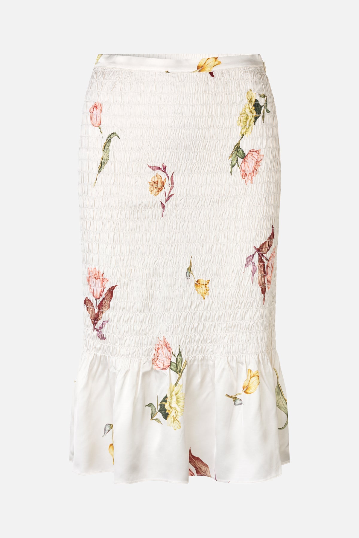 White skirt with a densely smocked waist and scattered pink, yellow and green floral print