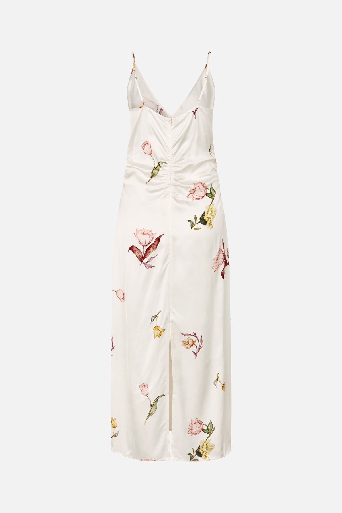 Front view of a long ivory slip dress with thin adjustable straps, a V-neck, ruched centre seam and scattered botanical flower print.