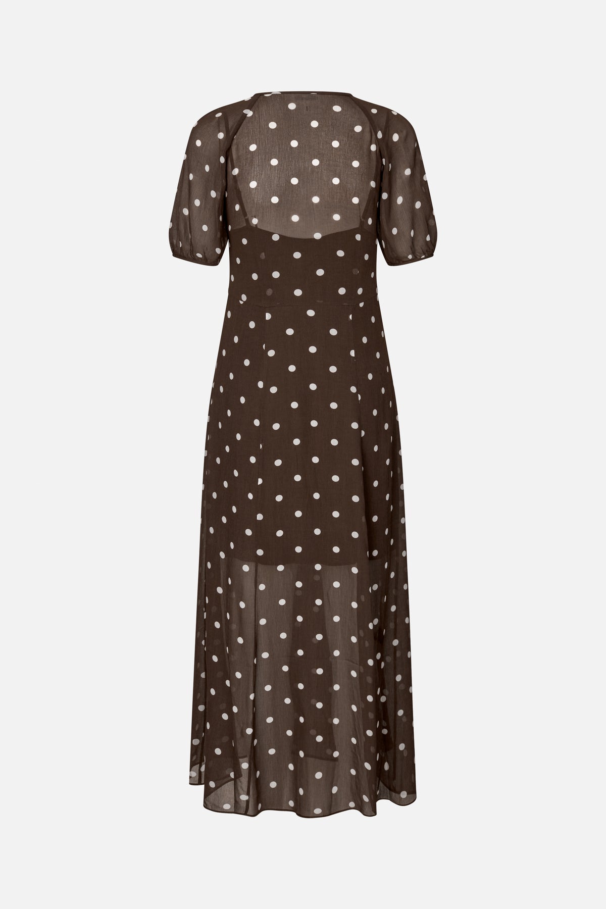 Rear view of a sheer dark brown maxi dress with white polka dots and elbow-length puff sleeves.