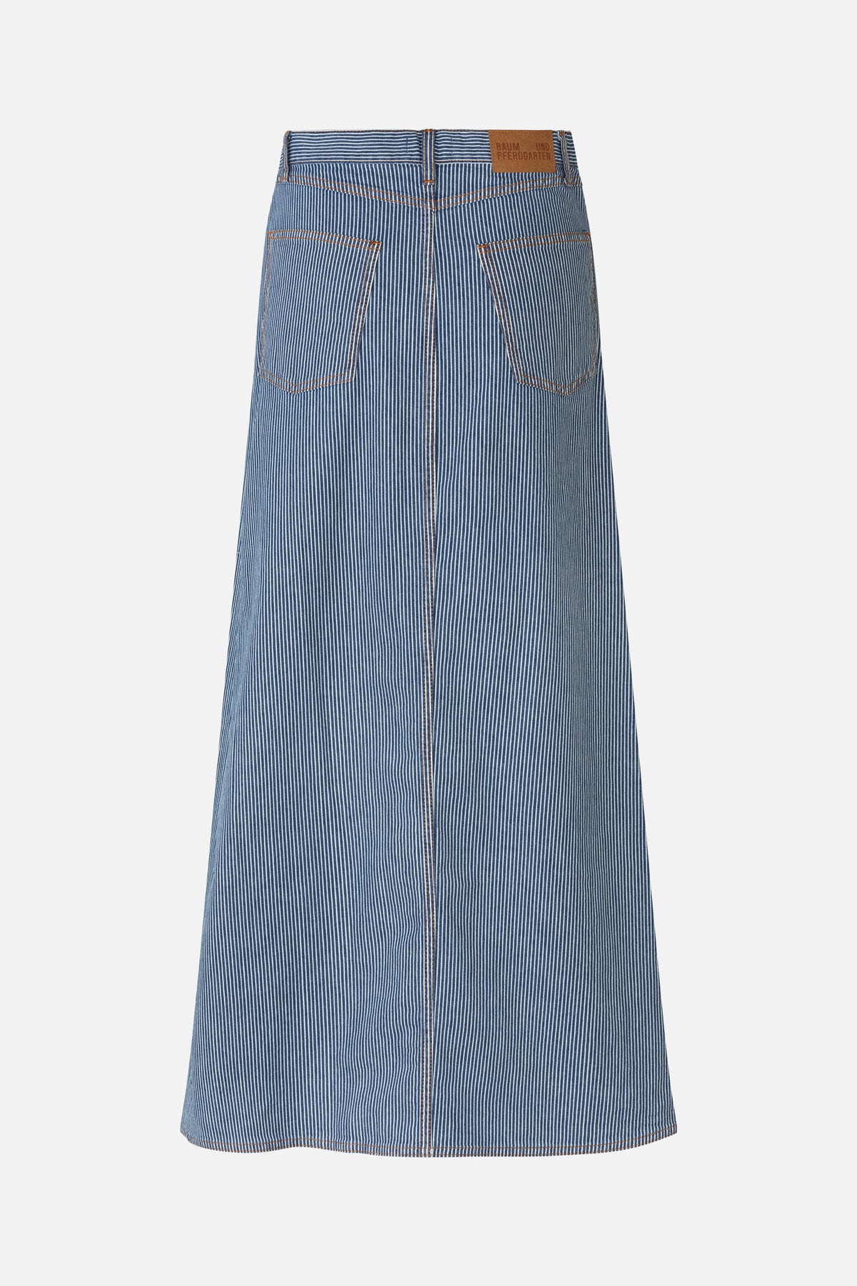 Back view of a blue denim skirt with narrow white vertical stripes, two patch pockets and contrast brown stitching.