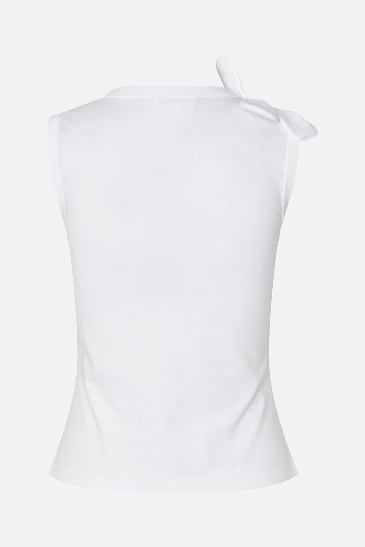 White sleeveless top with a tied bow detail at one shoulder, shown from the back.