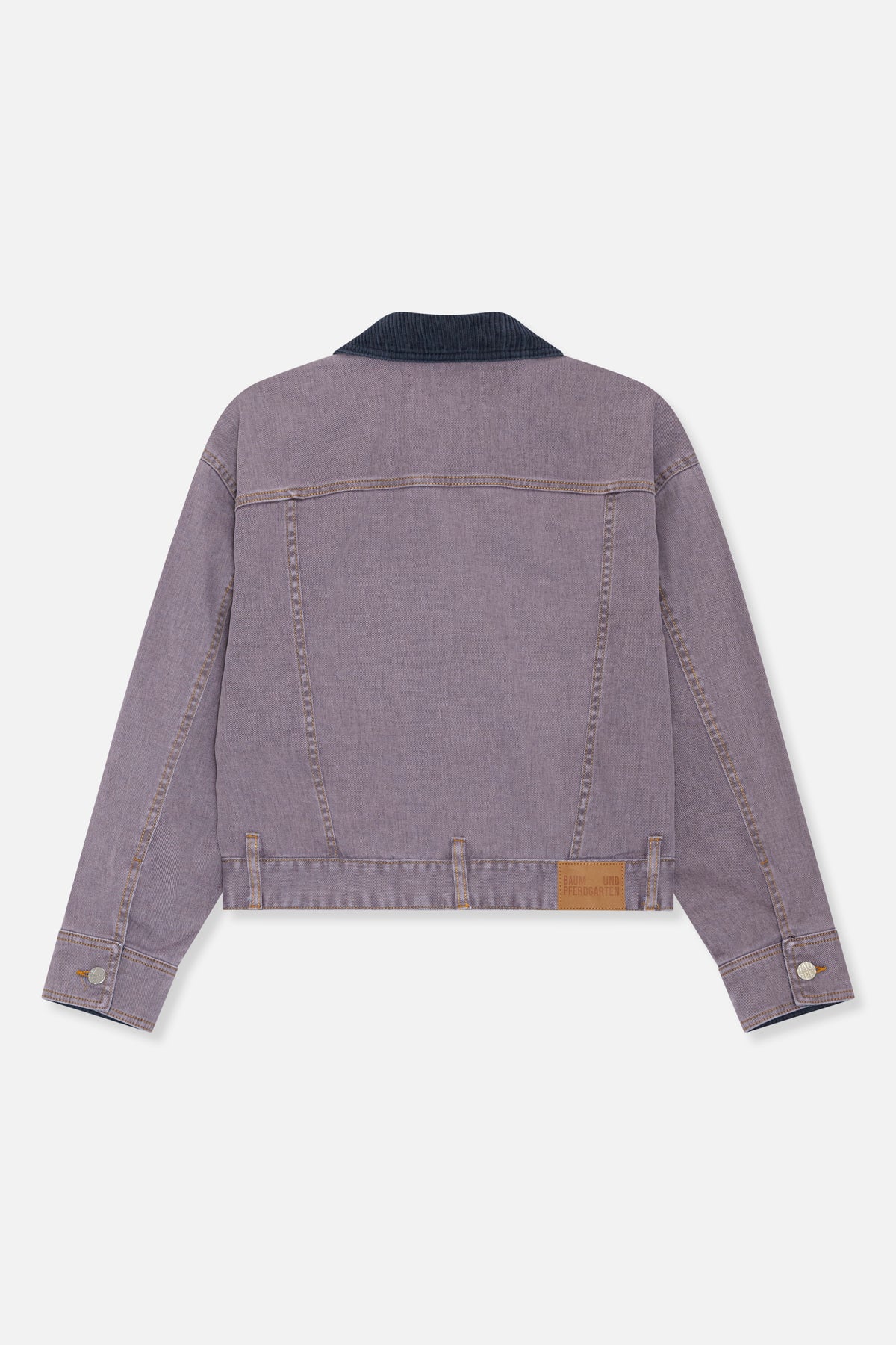 Back view of a mauve denim jacket with a dark ribbed collar, contrast stitching, cuff buttons and a tan hem patch.
