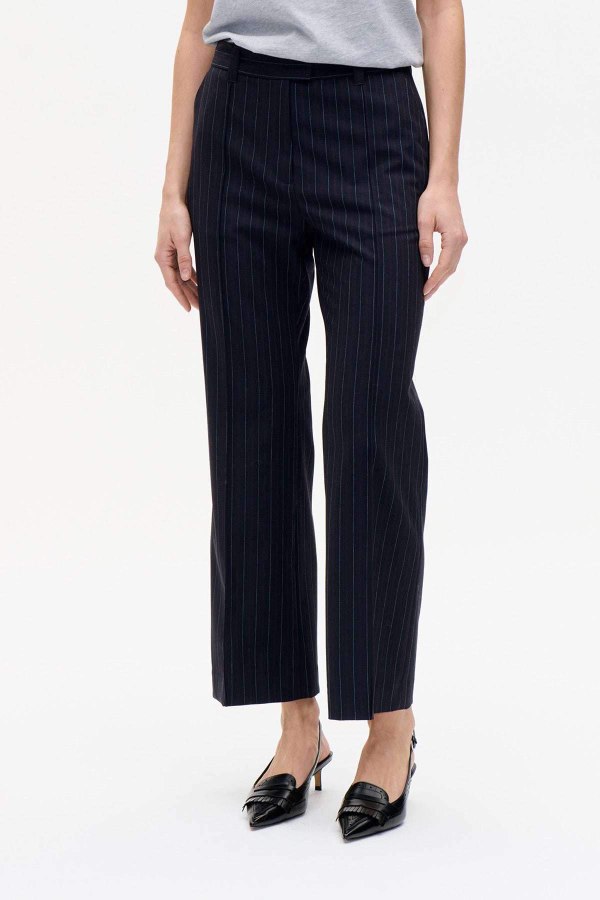 Front view of dark navy straight-leg trousers with fine vertical pinstripes and belt loops.