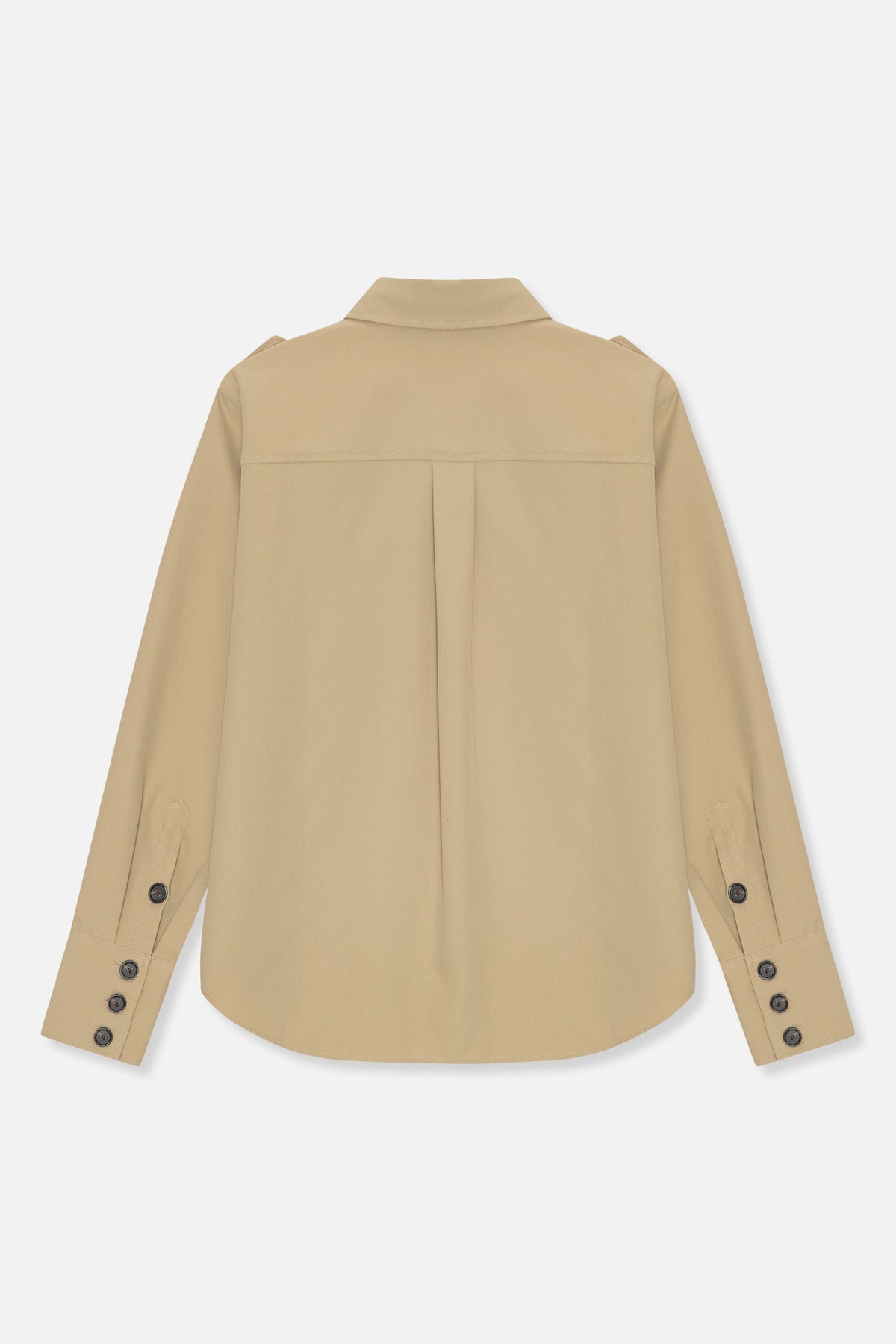 Back view of a plain beige long-sleeved shirt with a pointed collar, shoulder yoke, centre pleat and buttoned cuffs.