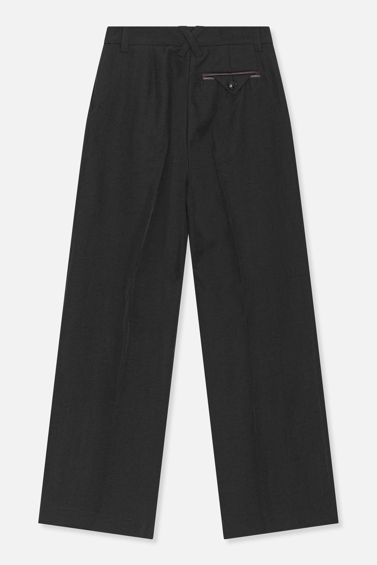 Back view of black wide-leg trousers with belt loops, crossed waistband tabs, and a buttoned welt pocket.