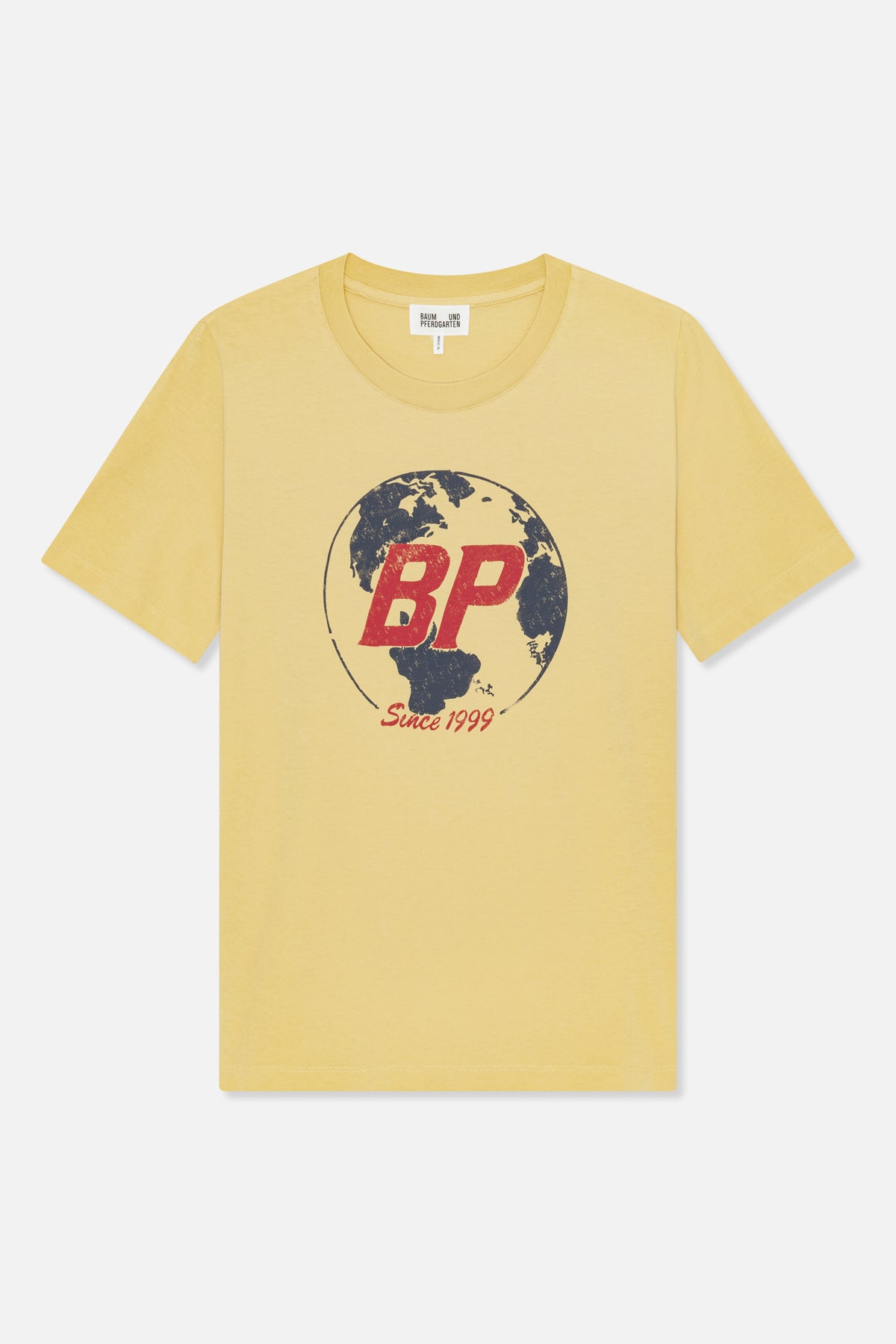 Front view of a pale yellow crew-neck T-shirt with a globe graphic, red “BP” lettering and “Since 1999” text.