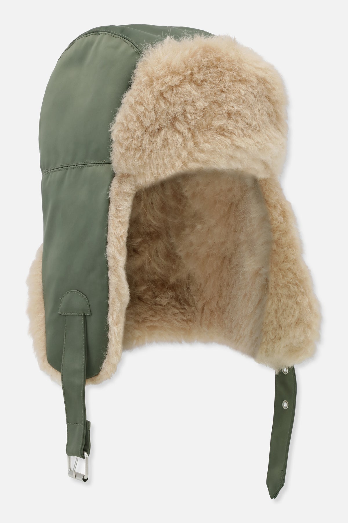 Cream fluffy trapper hat with olive green panels, long fastening straps and metal hardware, shown from the side.
