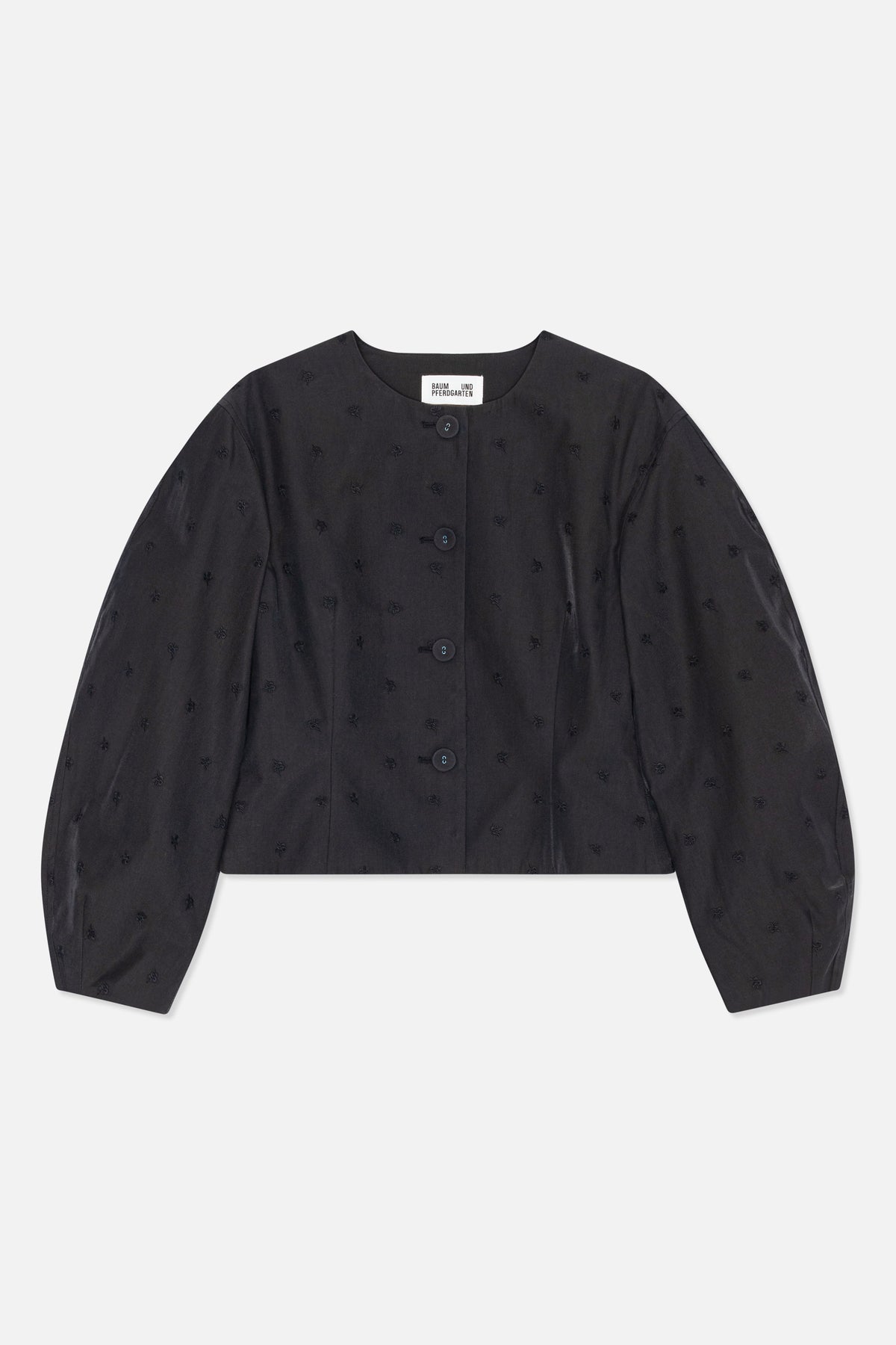 Front view of a black cropped jacket with a round neckline, long voluminous sleeves, front buttons and scattered tonal embroidered motifs.