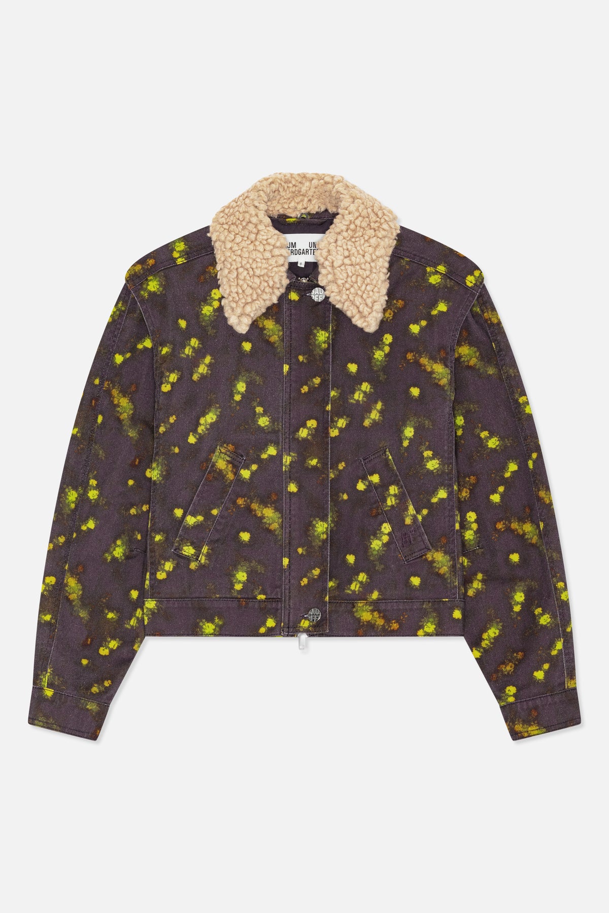 Front view of a dark charcoal denim jacket with scattered yellow-green and orange floral print, angled welt pockets, and a chunky cream textured collar.
