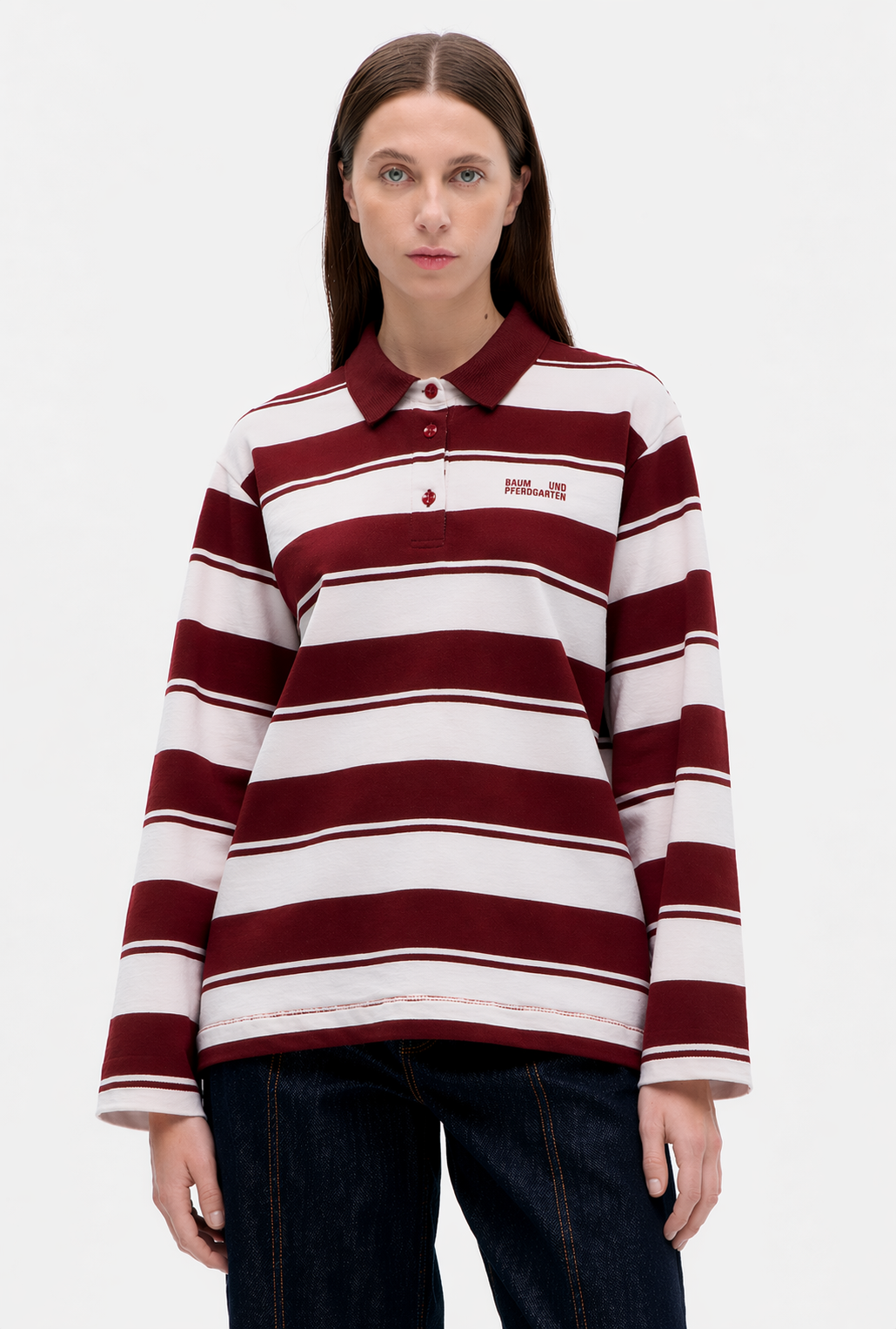 Front view of a long-sleeved burgundy and white striped rugby shirt with a pointed collar and button placket.