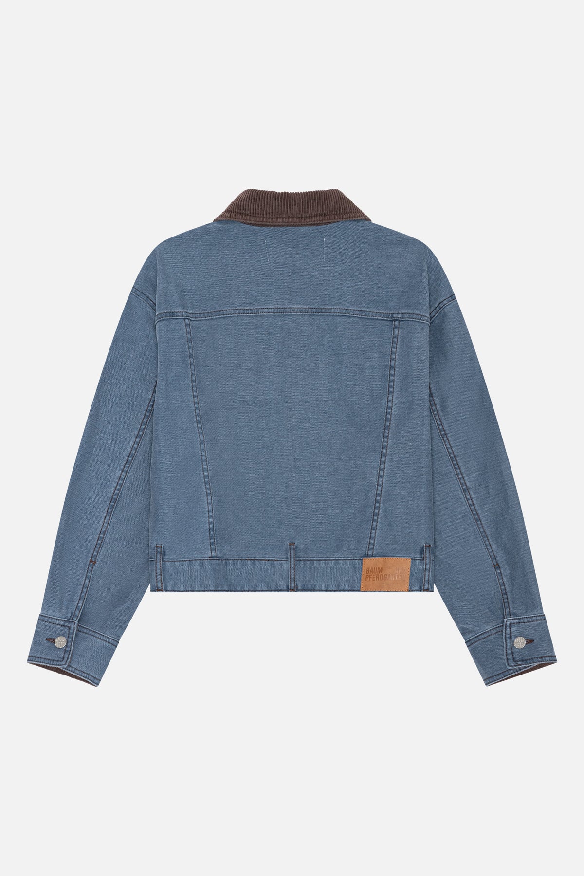 Back view of a blue denim jacket with a brown corduroy collar, stitched panel seams, and a leather-look hem patch.