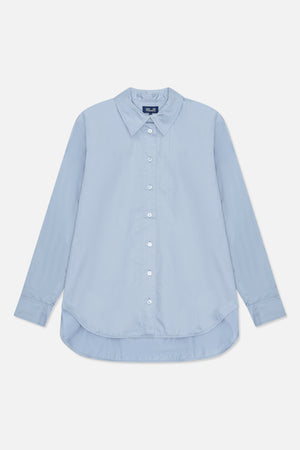 Light blue long-sleeved button-up shirt shown from the front, with a pointed collar, white buttons and a curved hem.
