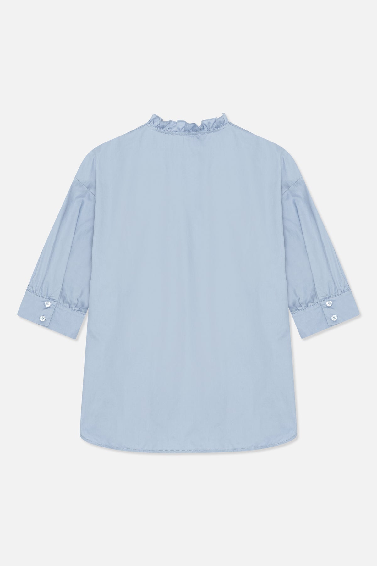 Back view of a pale blue blouse with a ruffled high neckline, loose sleeves and buttoned cuffs