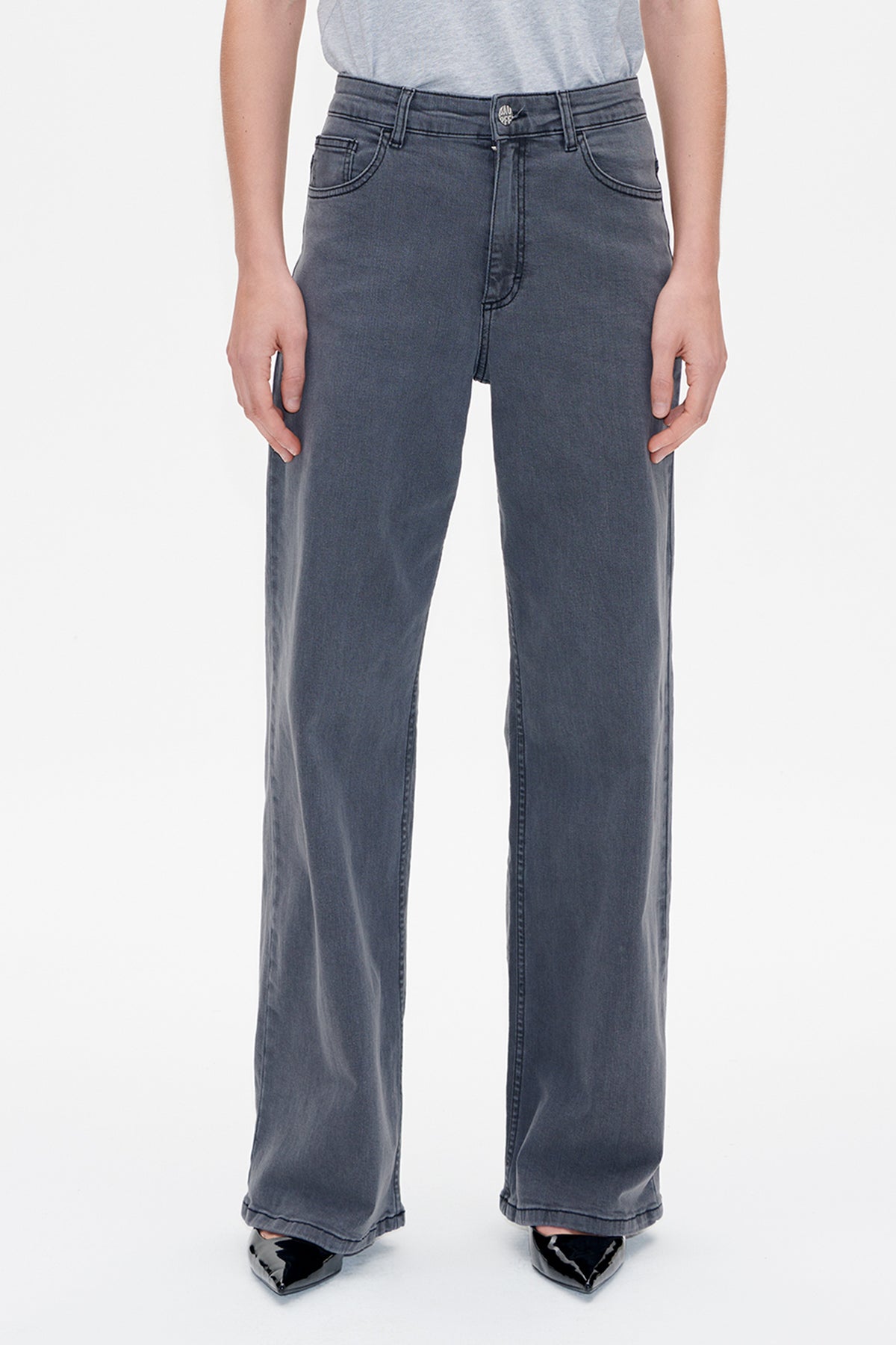 Front view of charcoal grey wide-leg jeans with faded detailing, contrast stitching, belt loops and curved front pockets.