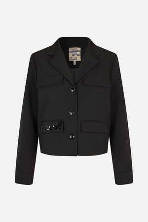 Front view of a black blazer with notched lapels, four flap pockets, dark buttons, and sequins on one lower pocket.