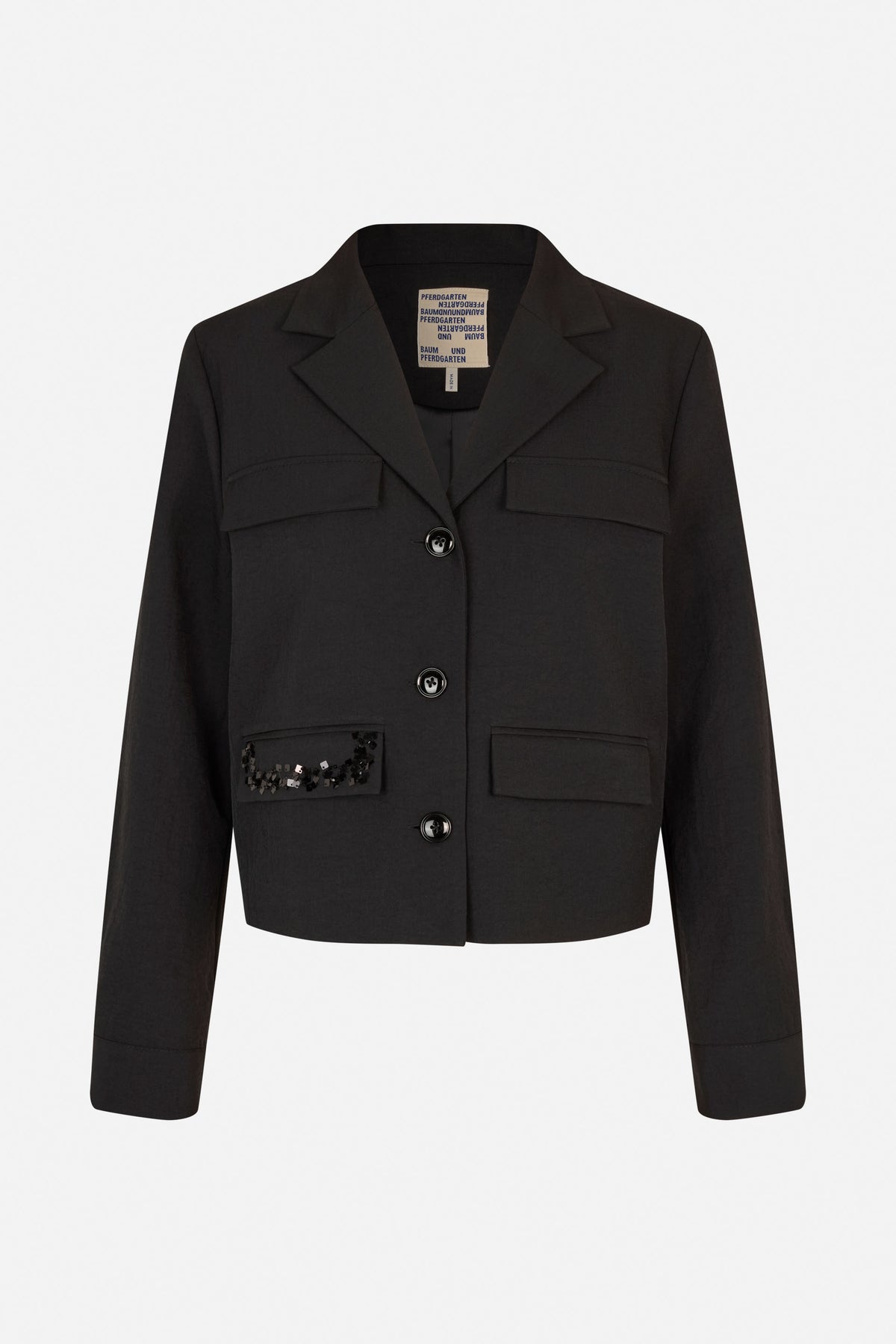 Front view of a black blazer with notched lapels, four flap pockets, dark buttons, and sequins on one lower pocket.