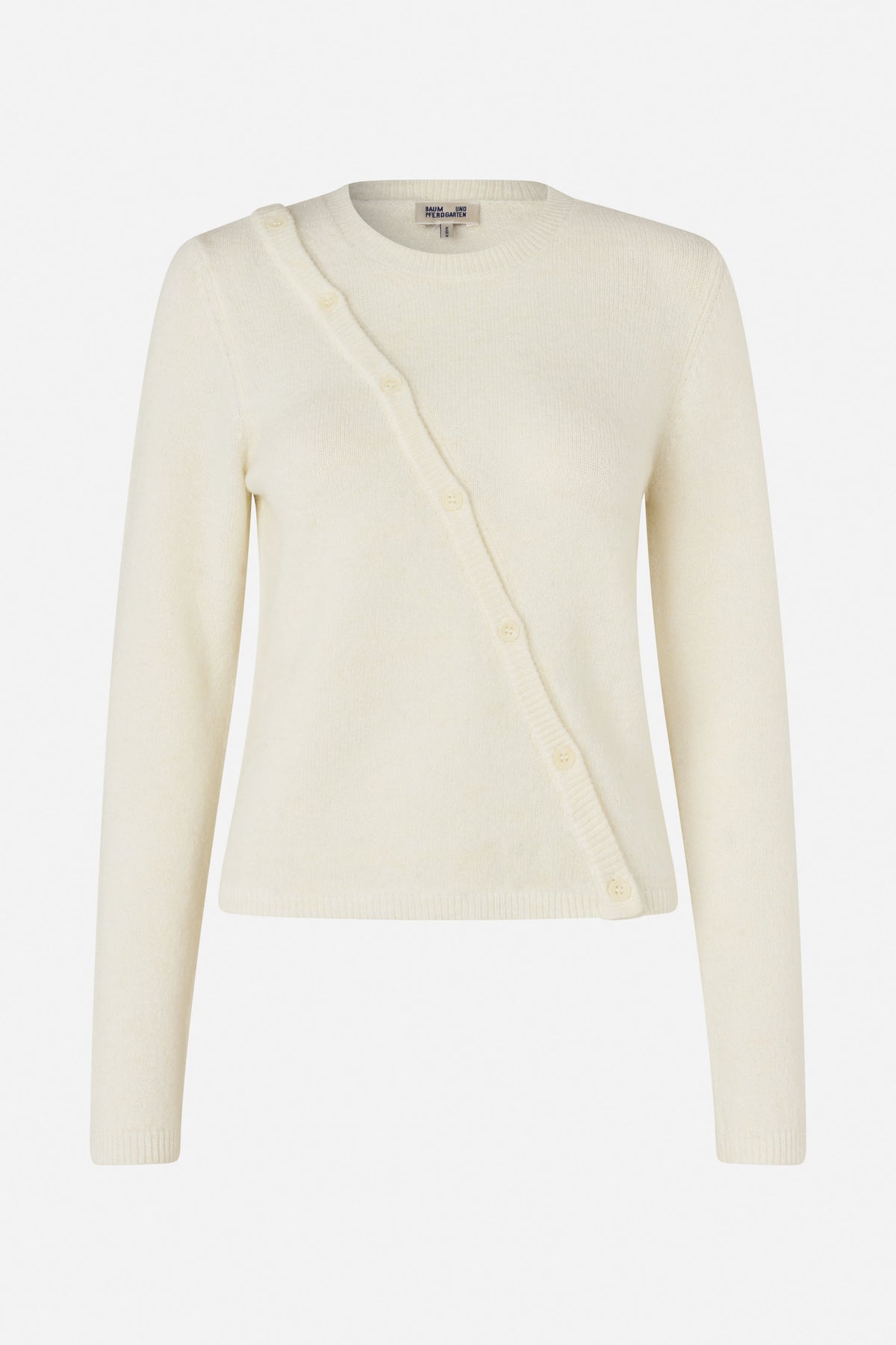 Front view of an ivory long-sleeved knit cardigan with a crew neck and buttons along an asymmetrical diagonal front opening.
