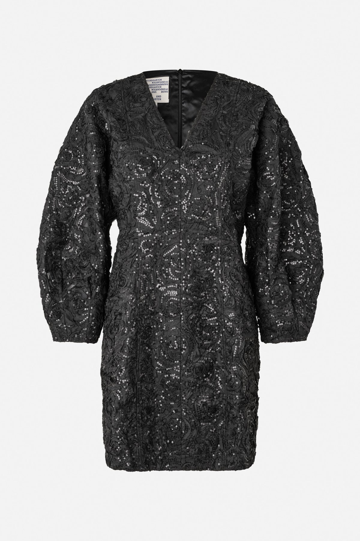 Front view of a black long-sleeved V-neck mini dress with raised swirling patterns and scattered sequins.