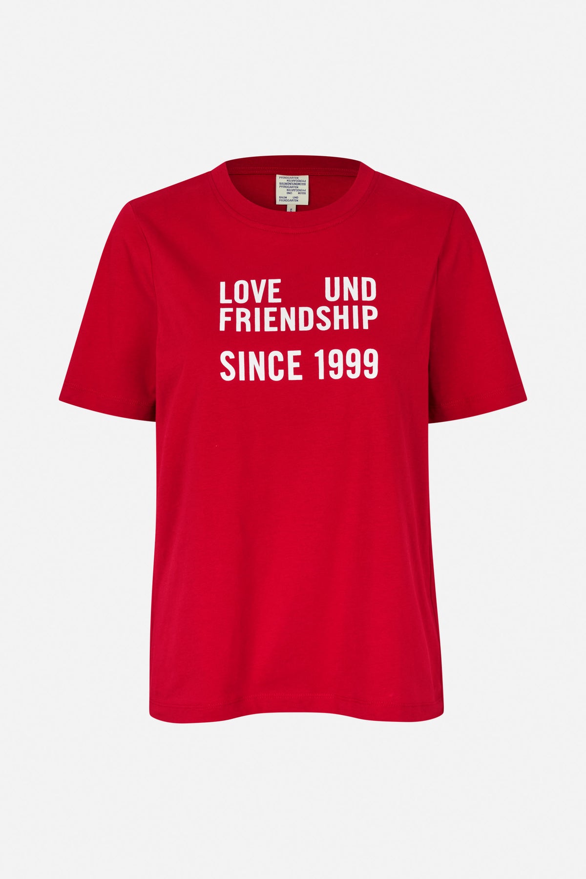 Red short-sleeved crew-neck T-shirt with white text reading “LOVE UND FRIENDSHIP SINCE 1999,” shown from the front.