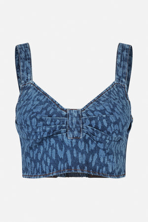 Front close-up of a blue denim-print cropped top with wide straps, a V-shaped neckline, centre panel and contrast stitching.