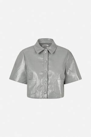 Front view of a light grey glossy short-sleeved shirt with a pointed collar, covered buttons and two patch pockets.