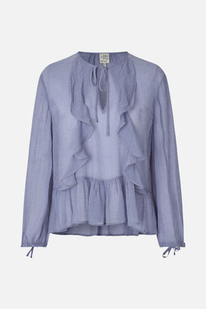 Front view of a pale blue textured long-sleeved blouse with a tie neckline, cascading ruffles, and a gathered peplum hem.