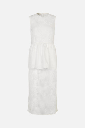 Front view of a white sleeveless dress with a round neckline, floral lace pattern and a gathered plain midsection panel.