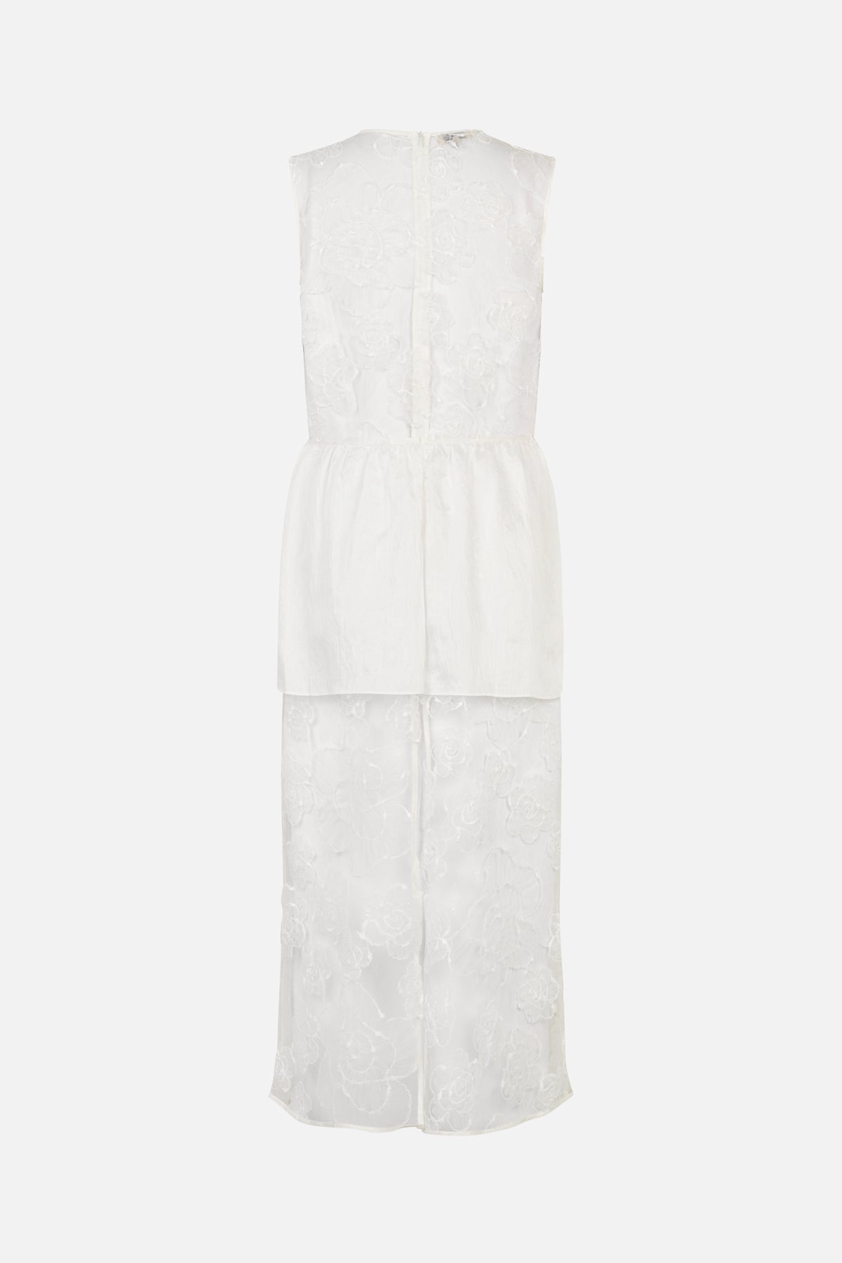 Back view of a white sleeveless floor-length dress with raised floral lace and a smooth overlay panel at the waist