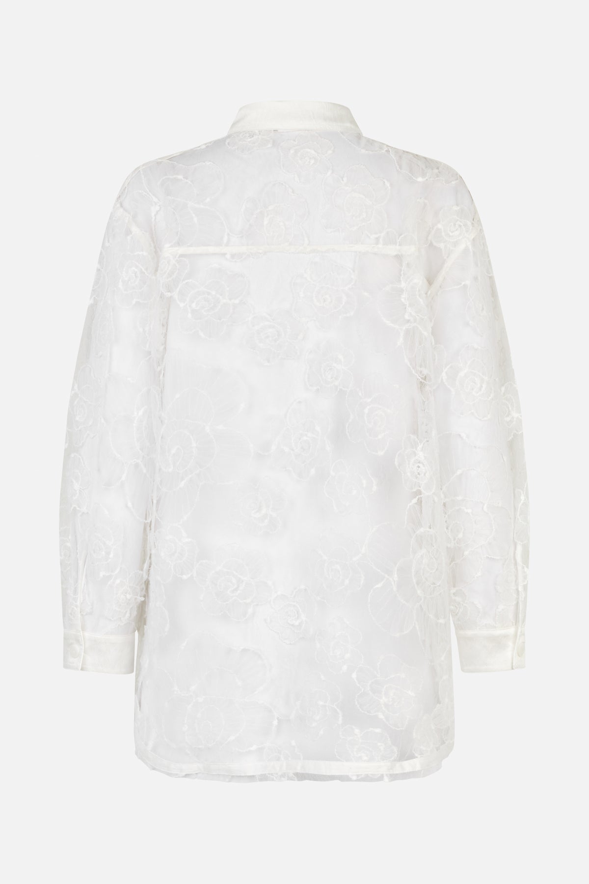 Back view of a white long-sleeved collared shirt with an all-over raised floral pattern and button cuffs.