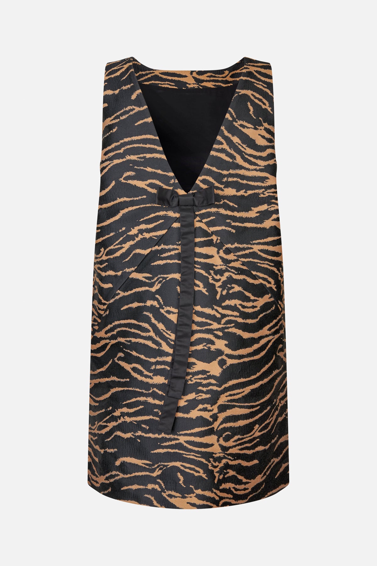 Front view of a sleeveless black and tan tiger-print dress with a deep V-neck and black bow detail