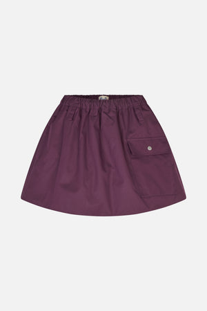 Front view of a plum A-line skirt with a gathered elastic waistband, slanted pockets and a flap cargo pocket.