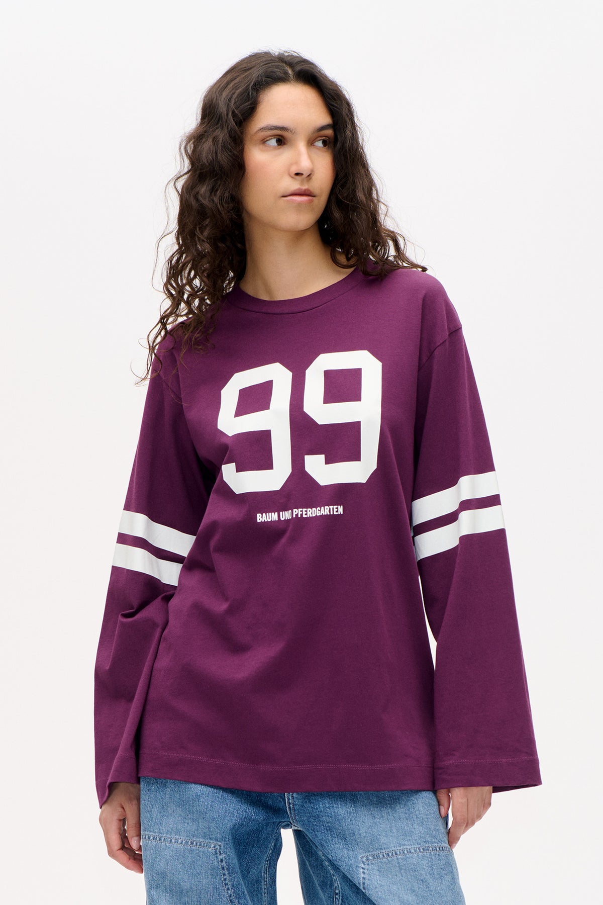 Front view of a plum sweatshirt with a large white “29,” white sleeve stripes, and Baum und Pferdgarten lettering.