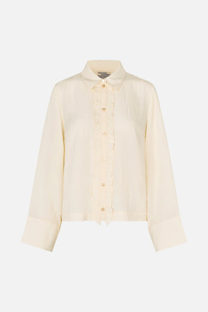 Front view of an ivory long-sleeved button-up blouse with a pointed collar, ruffled placket and wide cuffs.