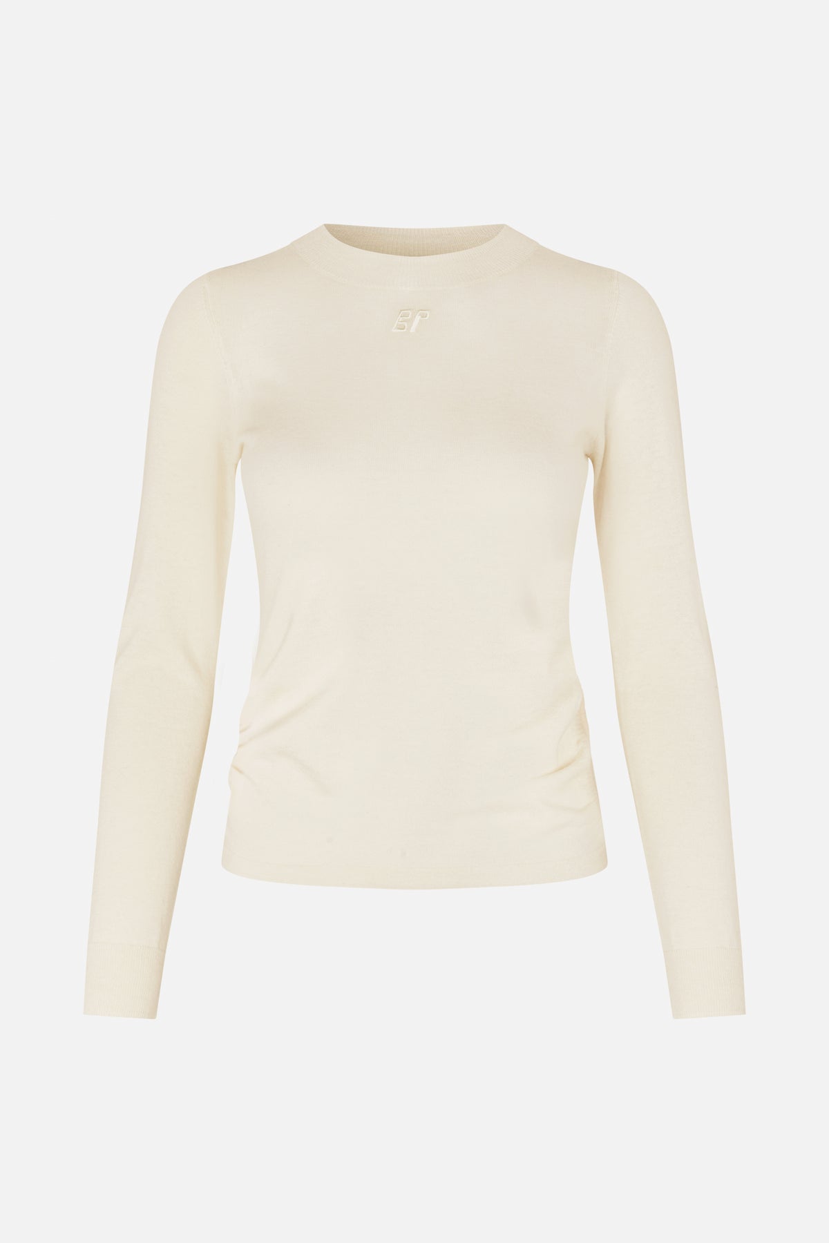 Front view of an ivory fitted long-sleeve knit top with a crew neck and small tonal embroidered chest logo.
