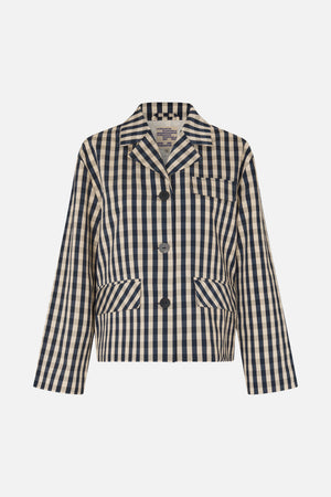 Front view of a beige and navy checked cropped jacket with notched lapels, dark buttons, a chest pocket and large flap pockets.
