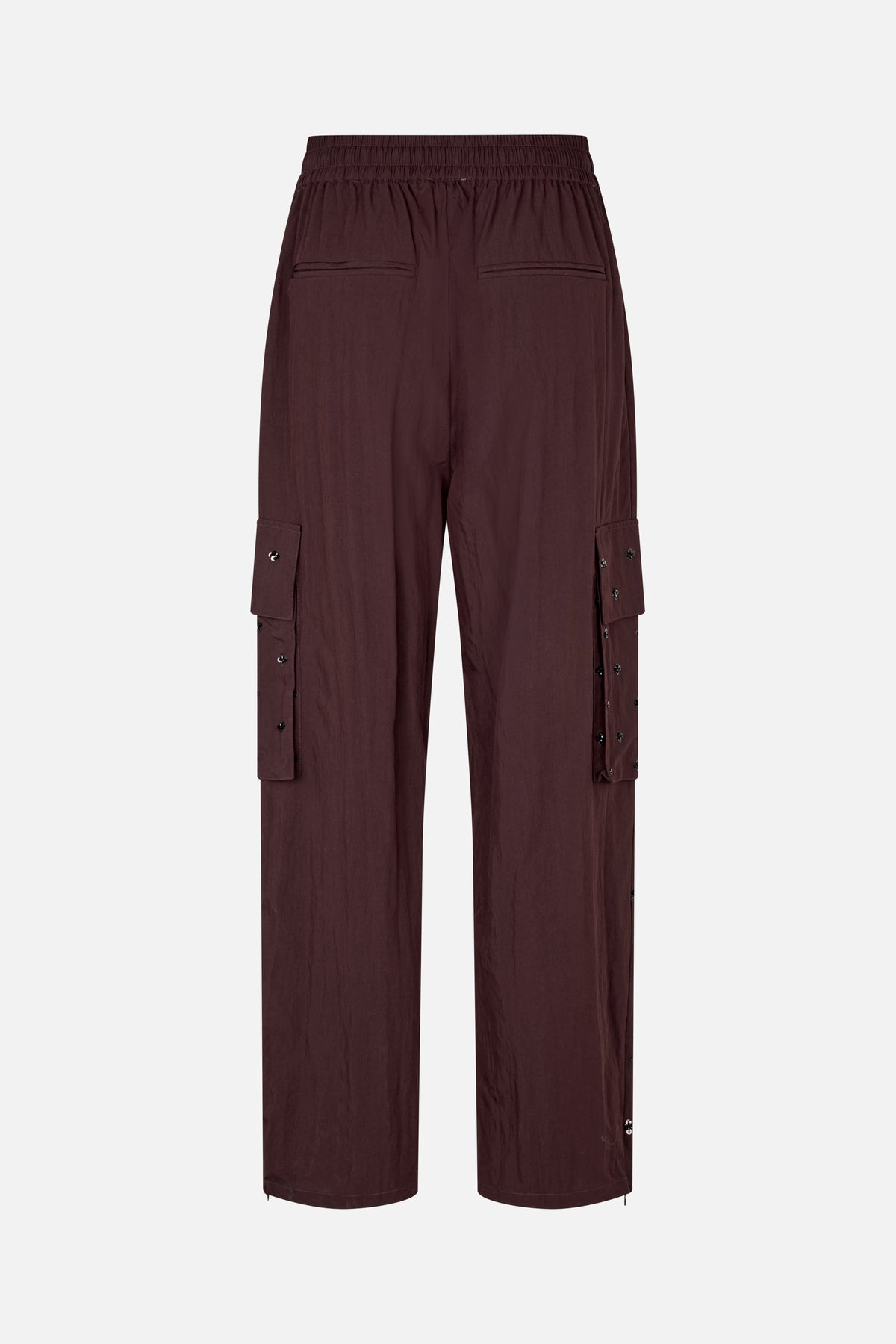 Back view of dark burgundy wide-leg trousers with an elasticated waistband, welt pockets and button-detailed side cargo flaps.