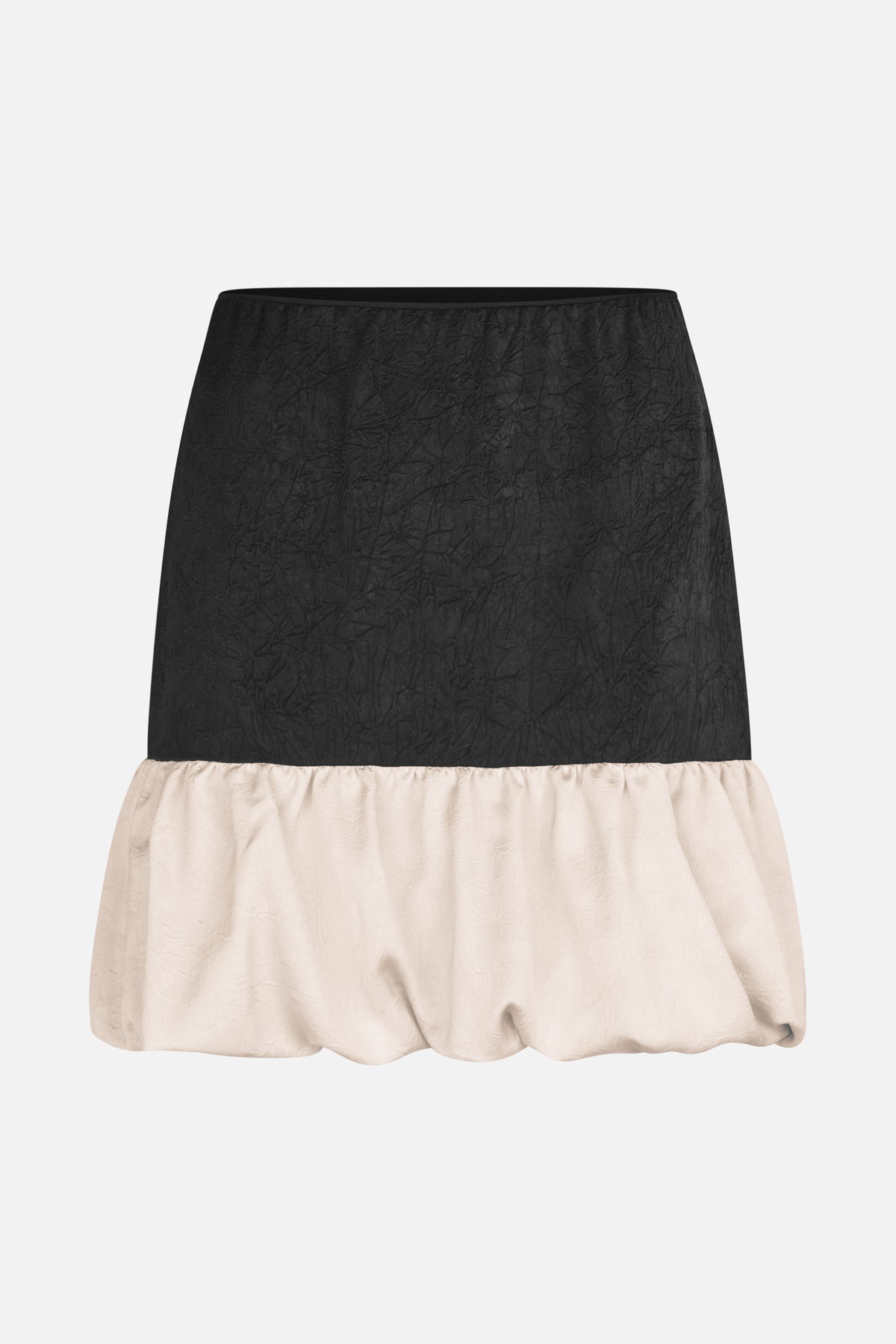 Two-tone skirt with a crinkled black upper panel and a gathered, voluminous ivory hem.